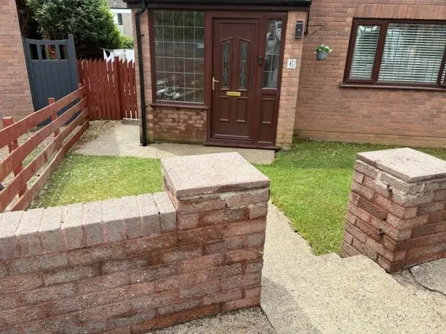 Brick boundary wall after professional cleaning in Bristol with restored brickwork and improved appearance