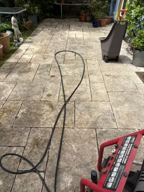 Patio before professional patio cleaning in Redland with algae and weather staining